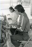 Native American man and woman creating pottery