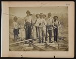 Men standing on railroad track