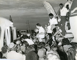 Memphis State University football team arrives home after victory, 1975