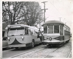 Trolleybus makes way for electric bus, Memphis, 1947