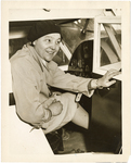 Phoebe Fairgraves Omlie, leaning out of a cockpit, circa 1934-1936