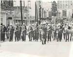 Policemen marching on Beale Street, Memphis, 1968