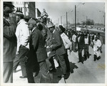 Memphis sanitation workers enter Memphis City Hall, 1968 by James Reid