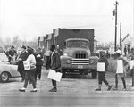 Protesters pass garbage trucks, Memphis, 1968