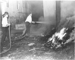 Memphis firemen dousing a fire, 1968